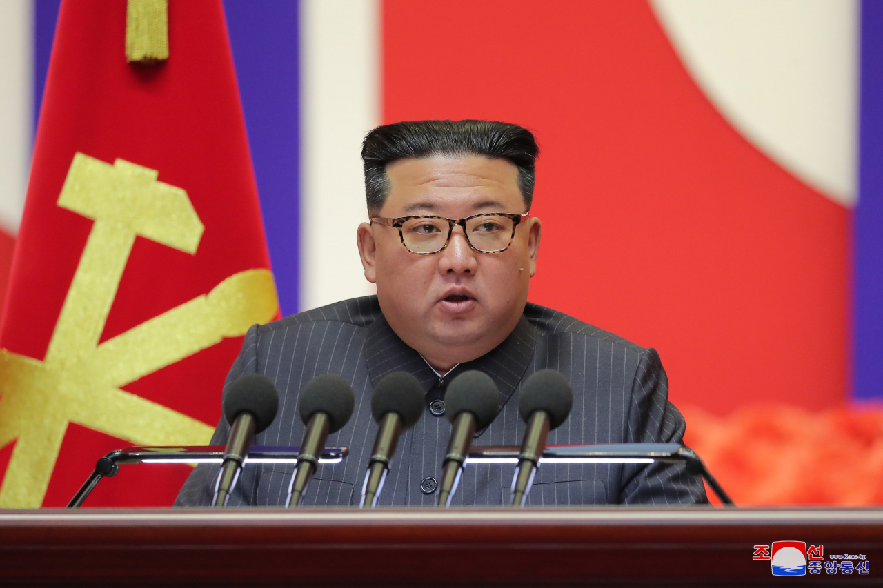 This photo, released by the North's official Korean Central News Agency on August 11, shows North Korean leader Kim Jong-un making a speech to declare victory in the country's fight against COVID-19 during a national meeting on anti-epidemic measures in Pyongyang held the previous day. (KCNA)