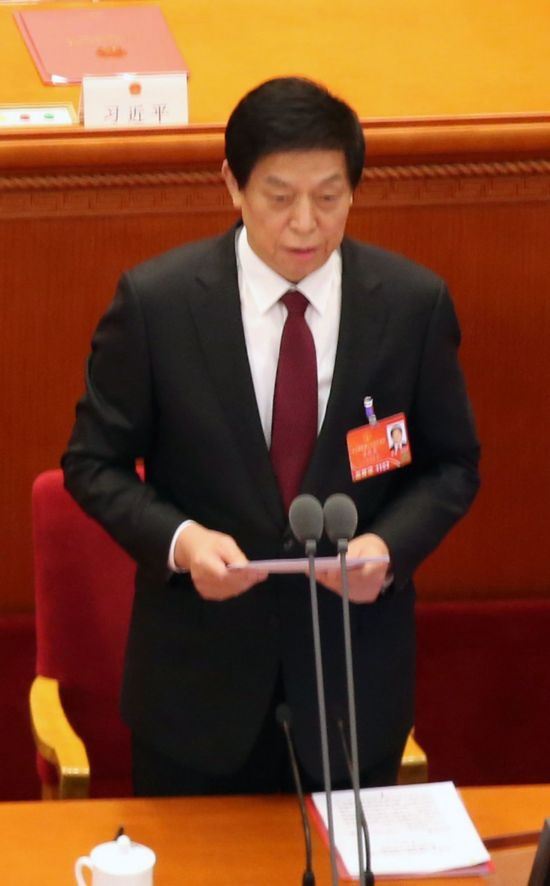 This March 11, file photo shows Li Zhanshu, China's third-ranked official and chief of the Standing Committee of the National People's Congress, delivering a speech during the closing ceremony of a National People's Congress meeting in Beijing. (Yonhap)