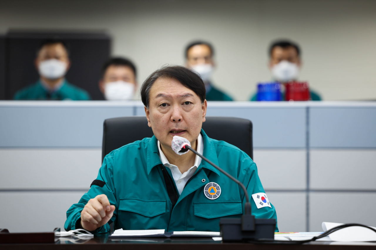 President Yoon Suk-yeol speaks during a meeting at the crisis management center of the presidential office in Seoul on Sunday, on the government's readiness against the approaching Typhoon Hinnamnor, in this photo provided by his office. (Presidential office)