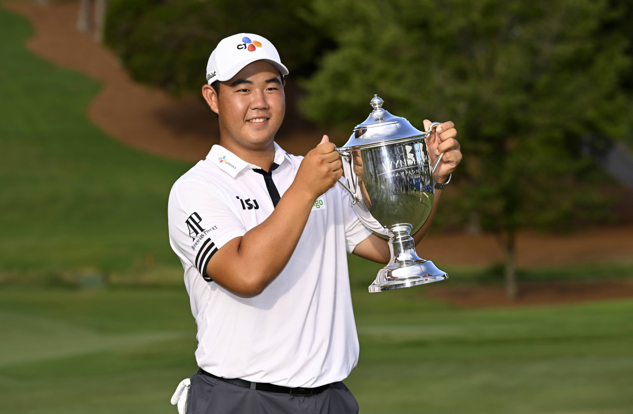 In this Getty Images file photo from Aug. 7, Kim Joo-hyung of South Korea hoists the champion's trophy after winning the Wyndham Championship at Sedgefield Country Club in Greensboro, North Carolina. (Getty Images)