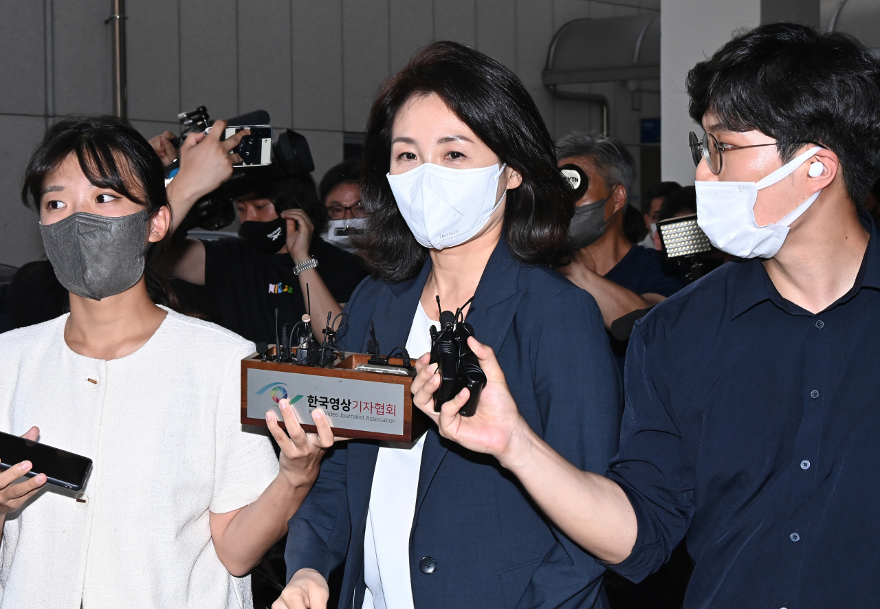 This file photo taken Aug. 23, 2022, shows Kim Hye-kyung, the wife of Democratic Party Chairman Lee Jae-myung, leaving the Gyeonggi Nambu Provincial Police Agency in Suwon, south of Seoul, after about five hours of questioning about her corporate card allegations. (Yonhap)