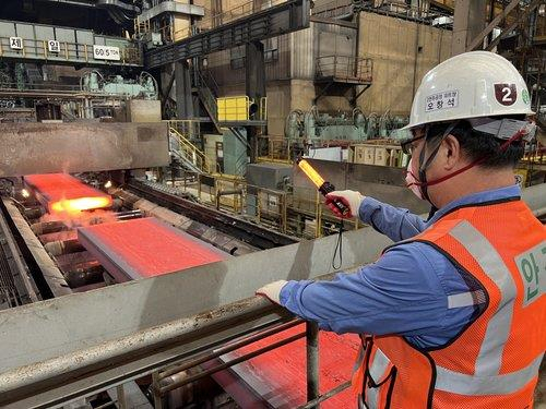 This photo, provided by POSCO, shows a worker checking the production of steel products at the No. 3 blast furnace at its major steel mill in Pohang, North Gyeongsang Province, on Tuesday, as the company resumed its operation after a weeklong suspension due to Typhoon Hinnamnor. (POSCO)