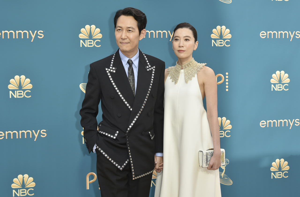 Lee Jung-Jae (left) and Lim Se-ryung arrive at the 74th Primetime Emmy Awards on Monday, at the Microsoft Theater in Los Angeles. (AP)