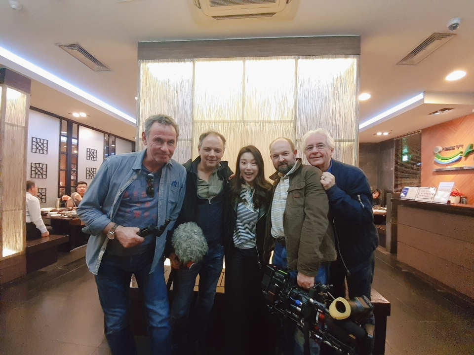 Thierry Loreau (right) and soprano Hwang Su-mi (center) pose with the filming crew. (Courtesy of Thierry Loreau)