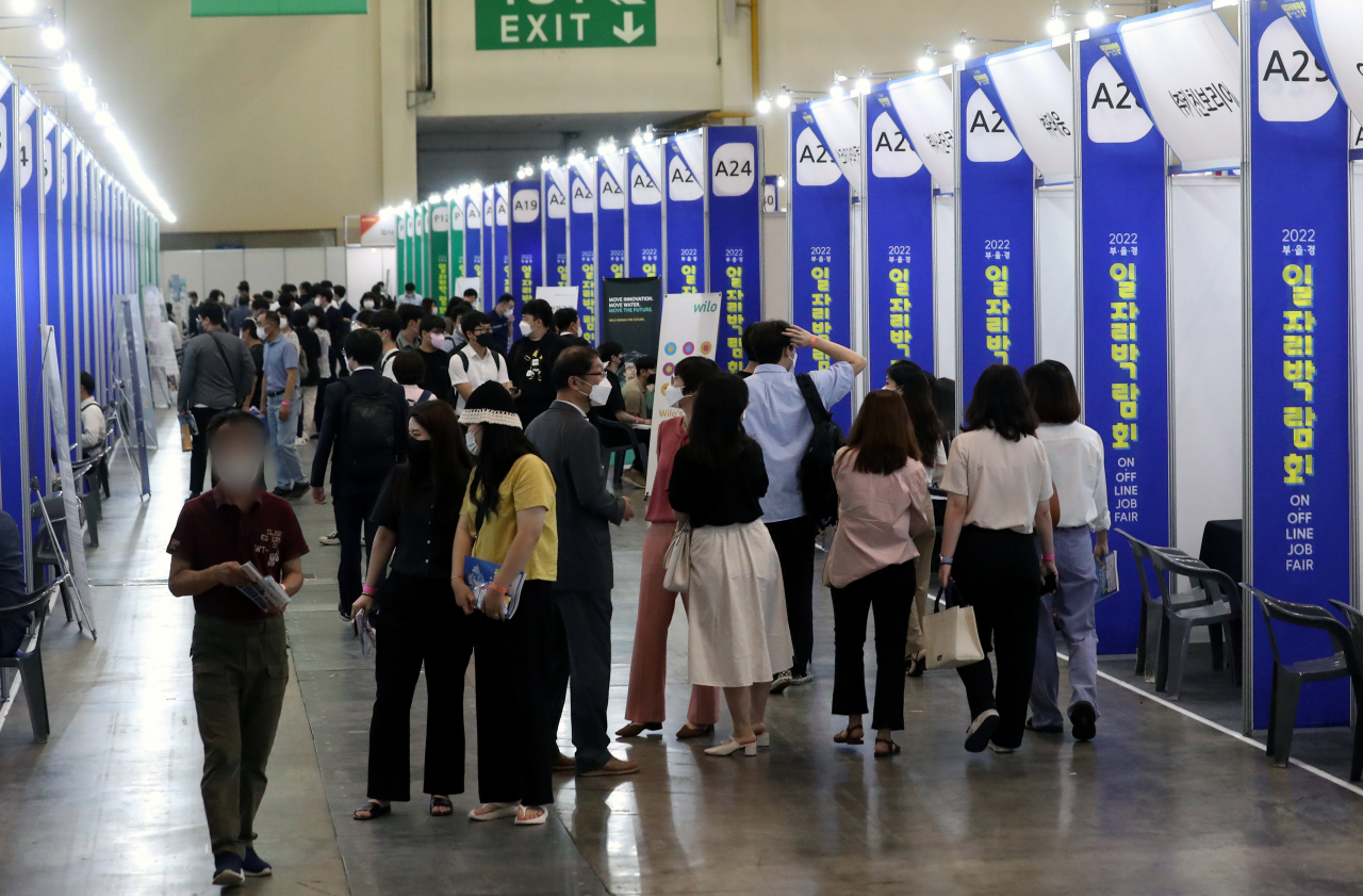This file photo, taken Aug. 30, 2022, shows people crowded at a job fair in the southern city of Busan. (Yonhap)