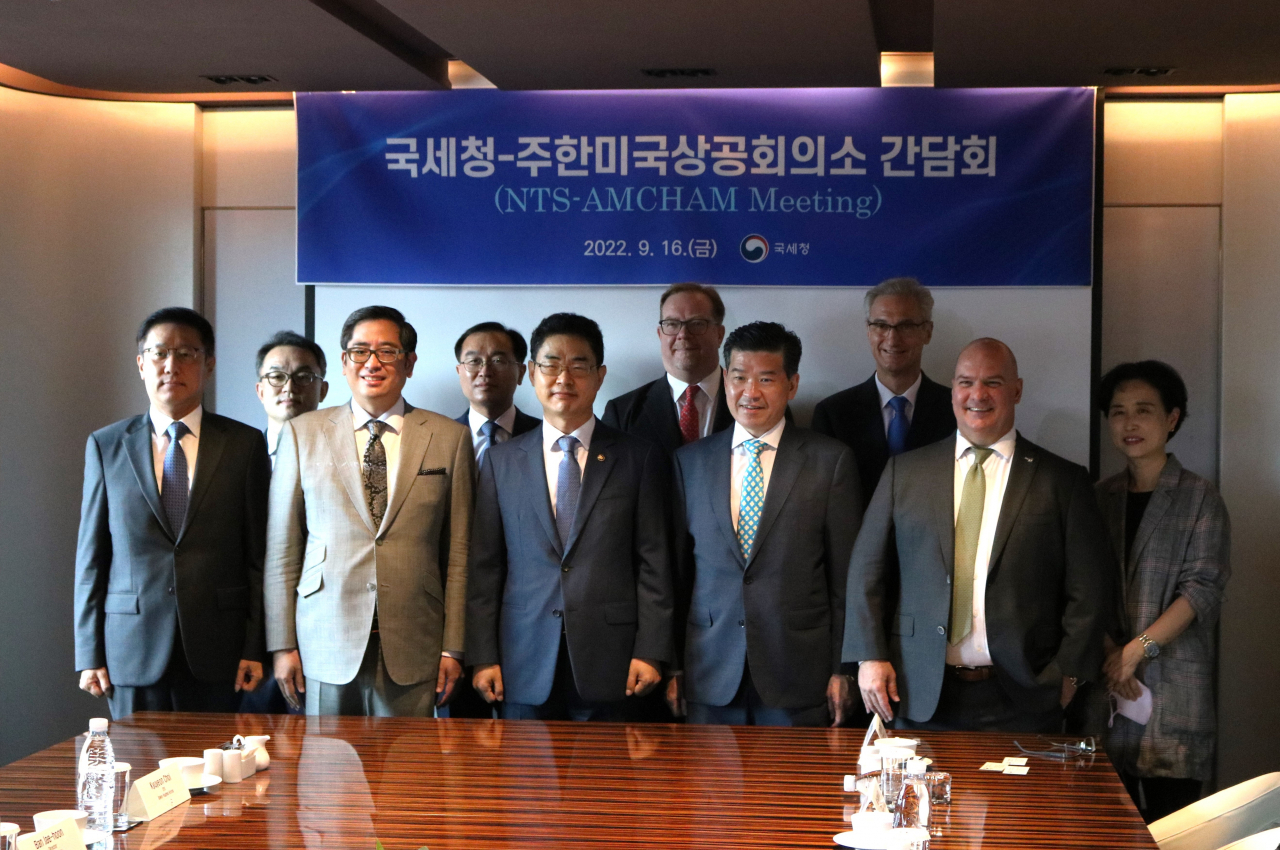 The American Chamber of Commerce in Korea and National Tax Service officials pose for a picture after Friday's meeting at the Plaza Seoul Hotel. (AmCham)