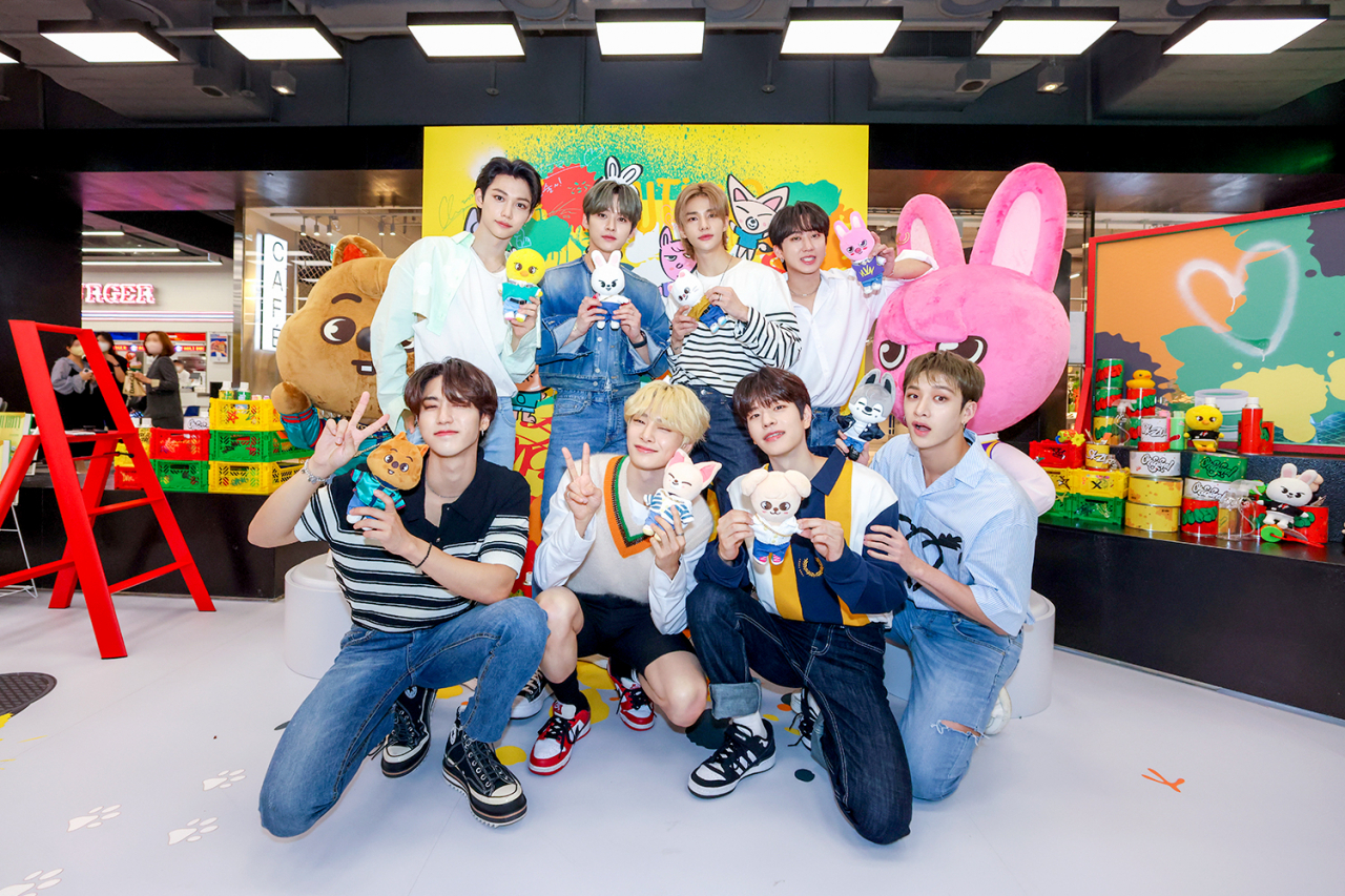 Stray Kids pose at their pop-up store “Stray Kids x SKZOO Pop-up Store ‘The Victory’ in Seoul” on May 30 at The Hyundai Seoul in Yeouido, Seoul. (JYP Entertainment)