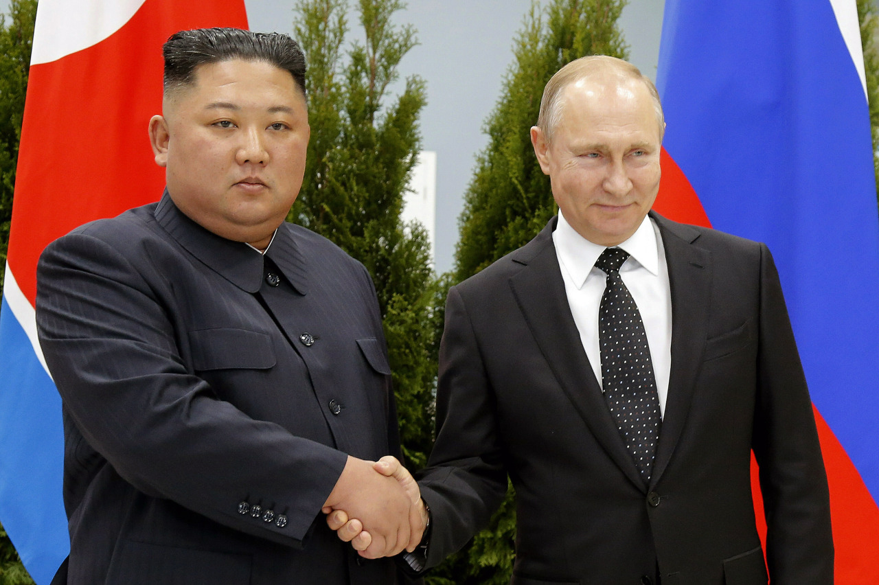 Russian President Vladimir Putin, right, and North Korea`s leader Kim Jong-un shake hands during their meeting in Vladivostok, Russia, April 25, 2019. North Korea says it has not exported any weapons to Russia during the war in Ukraine and has no plans to do so, and said U.S. intelligence reports of weapons transfers were an attempt to tarnish North Korea`s image. (FILE PHOTO - AP)