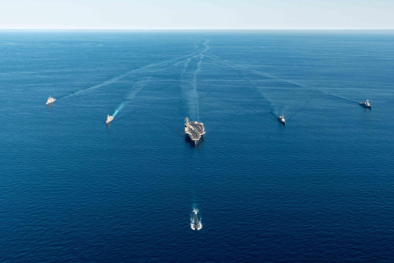 This photo, provided by the South Korean Navy, shows naval ships, including the USS Ronald Reagan aircraft carrier, participating in a joint anti-submarine drill between South Korea, the United States and Japan in the East Sea on Sept. 30, 2022.