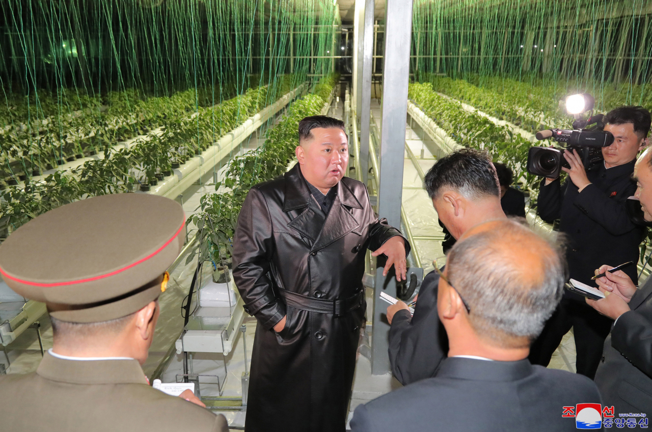 This photo, published by North Korea's Central News Agency on Tuesday, shows North Korean leader Kim Jong-un speaking to party officials as he attends a ceremony to mark the completion of a greenhouse farm in the country's eastern province on the occasion of the 77th founding anniversary of the ruling Workers' Party of Korea. (KCNA)