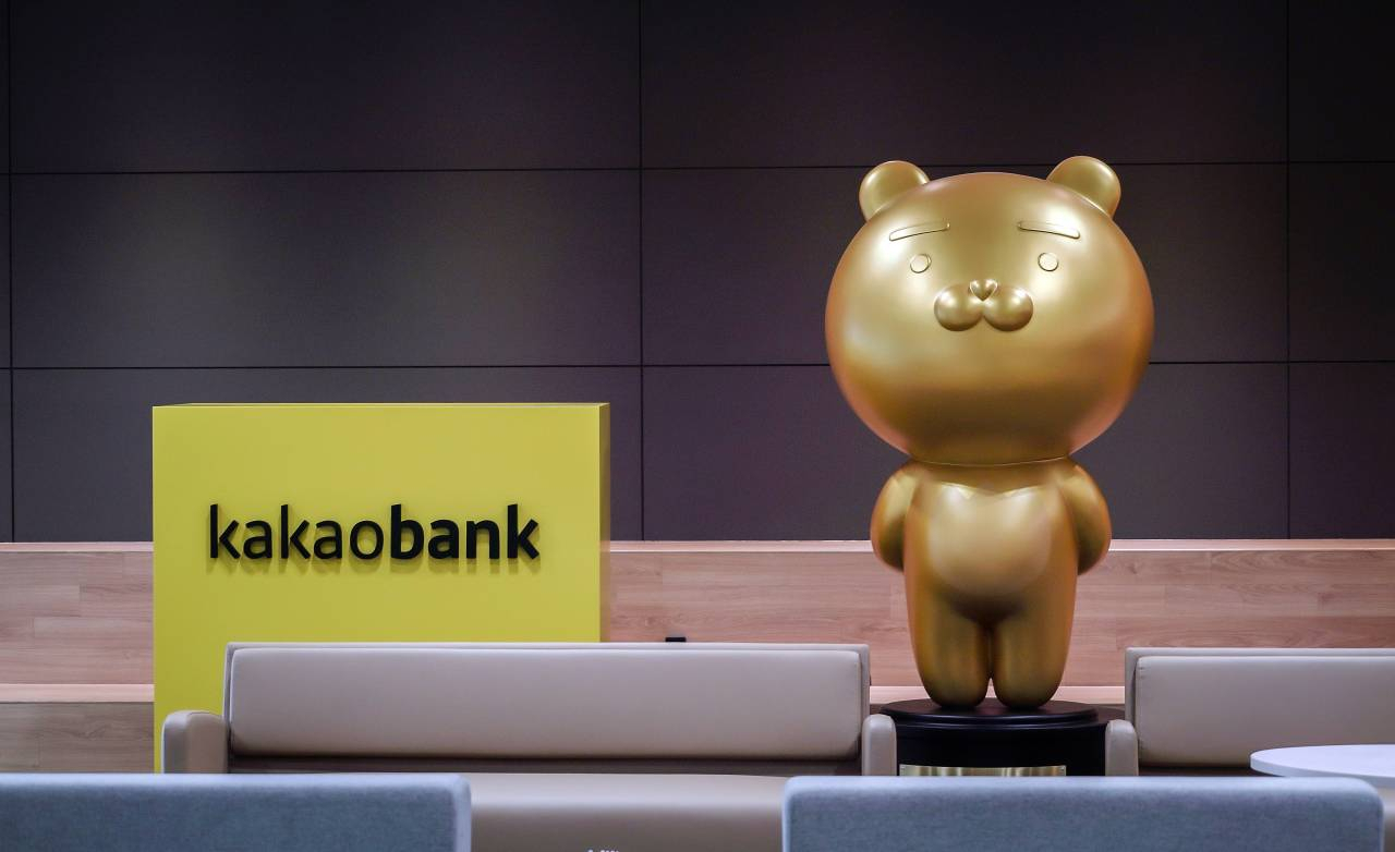 A KakaoBank logo is seen next to a Kakao Friends character. (KakaoBank)