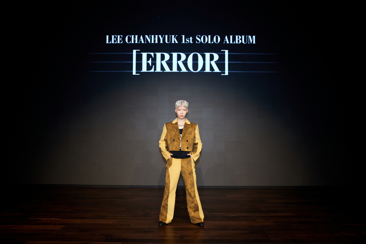 Lee Chan-hyuk poses during a press conference for his first solo album, “Error,” at YG Entertainment in Mapo-gu, western Seoul, on Monday. (YG Entertainment)