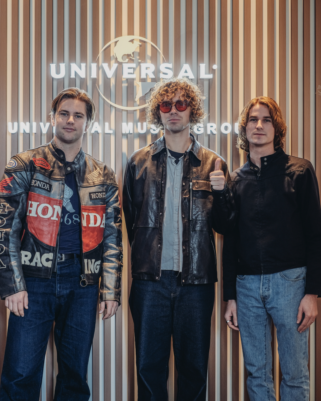 American alt-pop band almost monday poses for photos during a press conference held at Universal Music Korea’s headquarters in Gangnam-gu, southern Seoul, Tuesday. (Universal Music Korea)