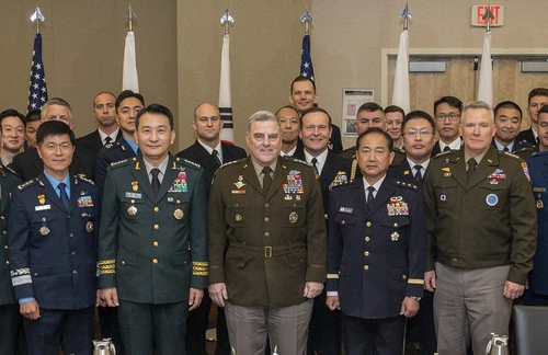 South Korea's Joint Chiefs of Staff (JCS) Chairman Gen. Kim Seung-kyum (second from left), his US counterpart, Gen. Mark Milley (center), and his Japanese counterpart, Gen. Koji Yamazaki (second from right), pose for a photo after trilateral talks in Washington on Thursday, in this photo provided by Seoul's JCS. (Seoul's JCS)