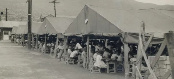 A tent school in Busan during the Korean War, similar to the Seoul tent school You studied in after the war. (National Archives of Korea, Busan Center)