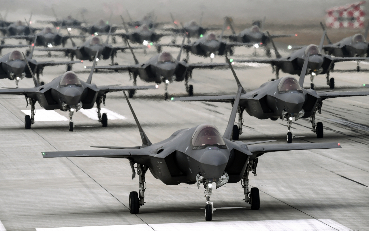 This file photo shows the South Korean Air Force's F-35A stealth fighters performing an elephant walk at an unidentified air base on March 25, 2022. (efense ministry)
