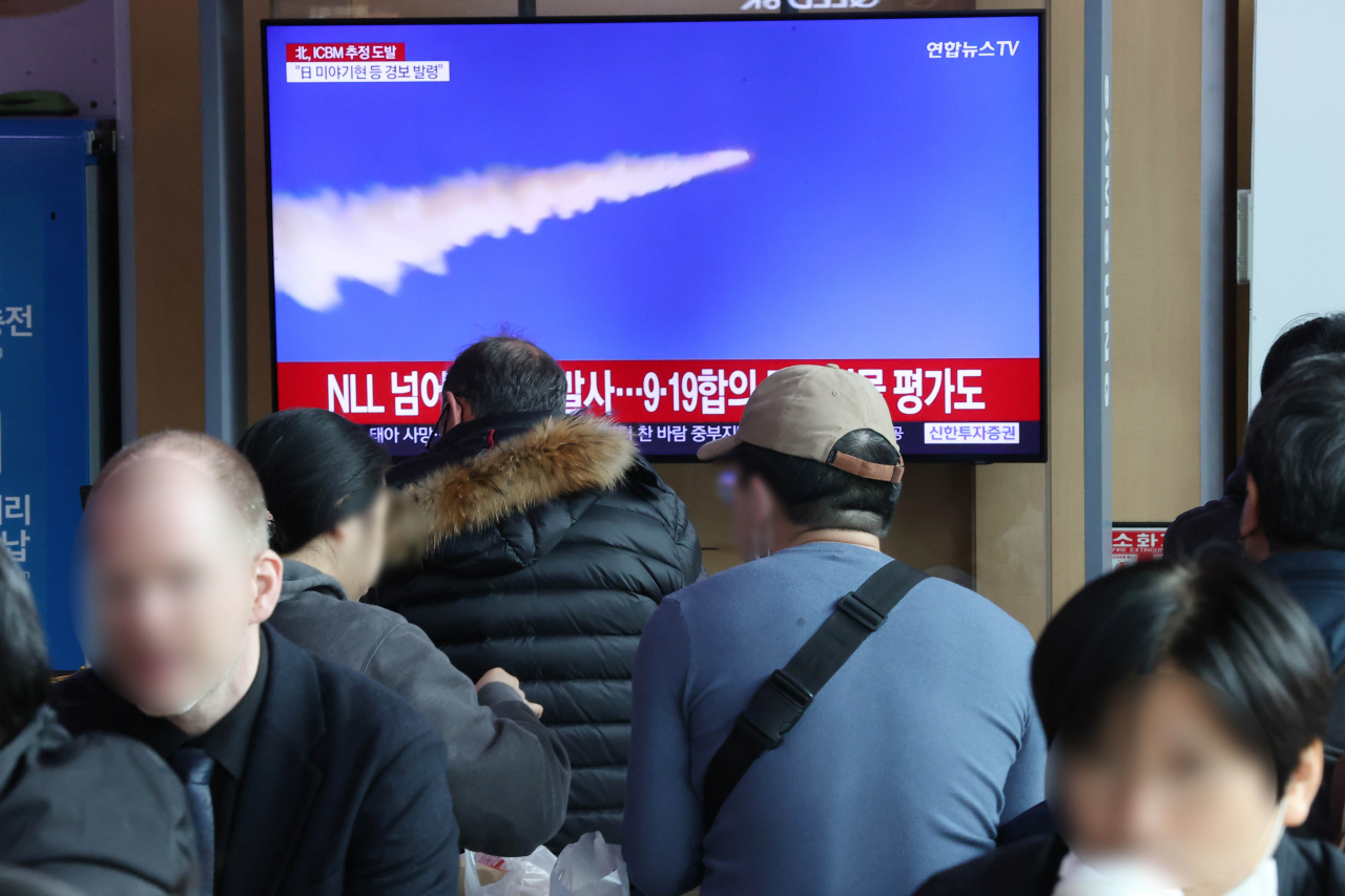 This photo, taken on Thursday, shows TV news footage on North Korea's firing of a long-range ballistic missile and two short-range ones. (Yonhap)
