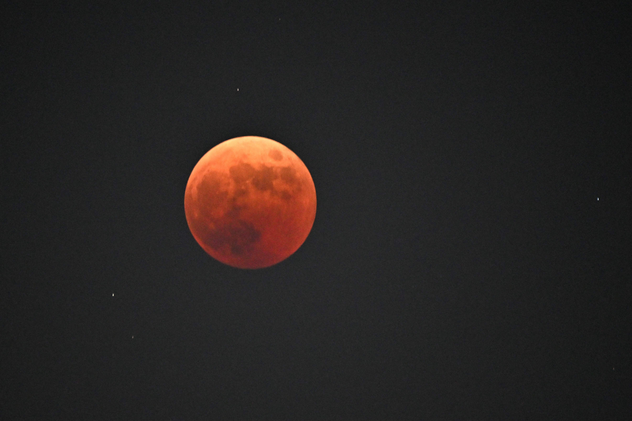 The blood moon is seen during a total lunar eclipse in Goyang, northwest of Seoul, Tuesday. (AFP-Yonhap)