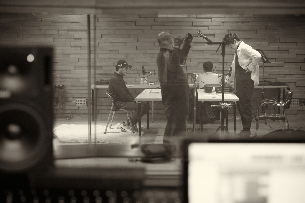 Yoo Jae-myung (left) and Kim Kang-woo (right) record in an audio booth for the audio movie 