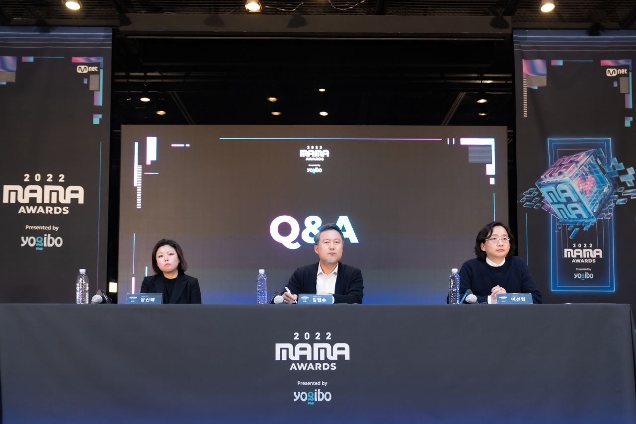 Officials of CJ ENM, Chief Producer Yoon Shin-hye (left), head of music content Kim Hyun-soo (center) and live entertainment business manager Lee Sun-hung, hold the 2022 Mama Awards global conference at CJ ENM Studio in Seoul on Wednesday. (CJ ENM)