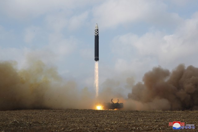 North Korea fires an intercontinental ballistic missile in this photo released by its state media on Saturday. (Yonhap)