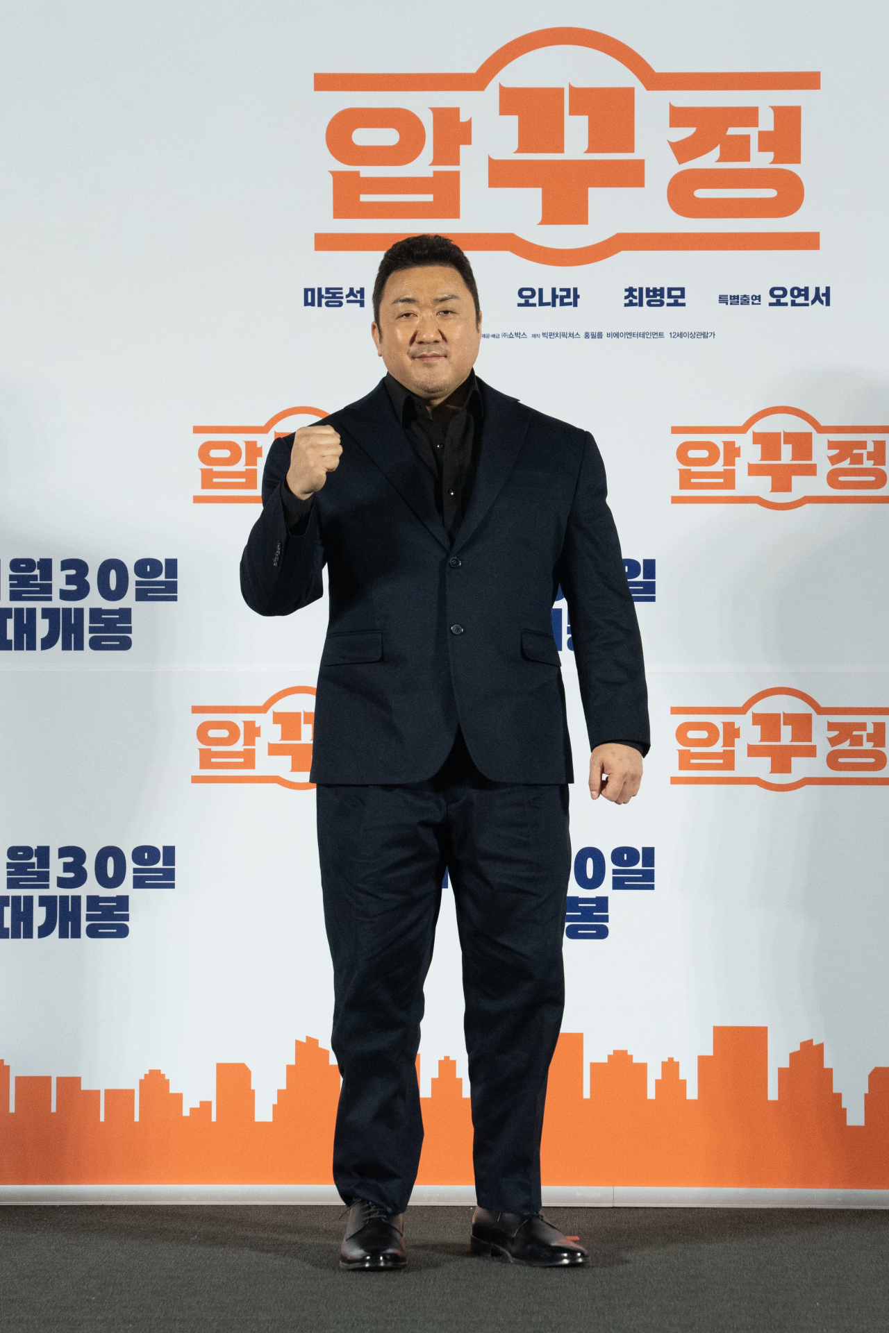 Don Lee poses for a photo after a press conference for the new comedy film 