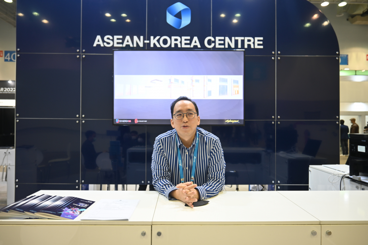 Joshua Ngooi Teck Hwa, head of trade and investment at ASEAN Korea Center, discusses the role of the ASEAN game pavilion at G-Star 2022 in Busan. (Sanjay Kumar/The Korea Herald)