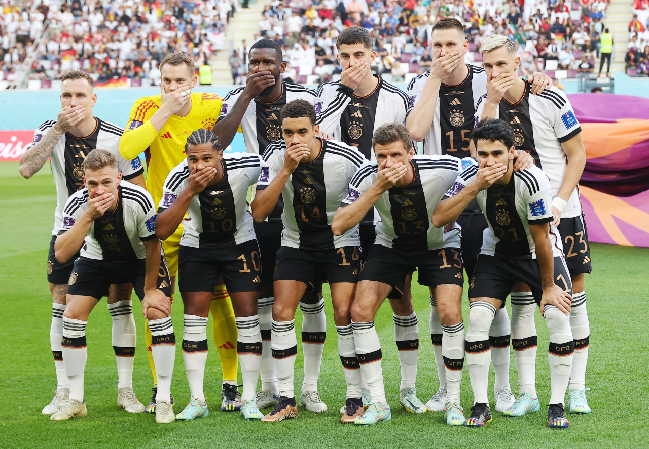 The starting players for Germany pose for their team photo ahead of their Group E match against Japan at the FIFA World Cup at Khalifa International Stadium in Al Rayyan, west of Doha, on Wednesday. (Yonhap)