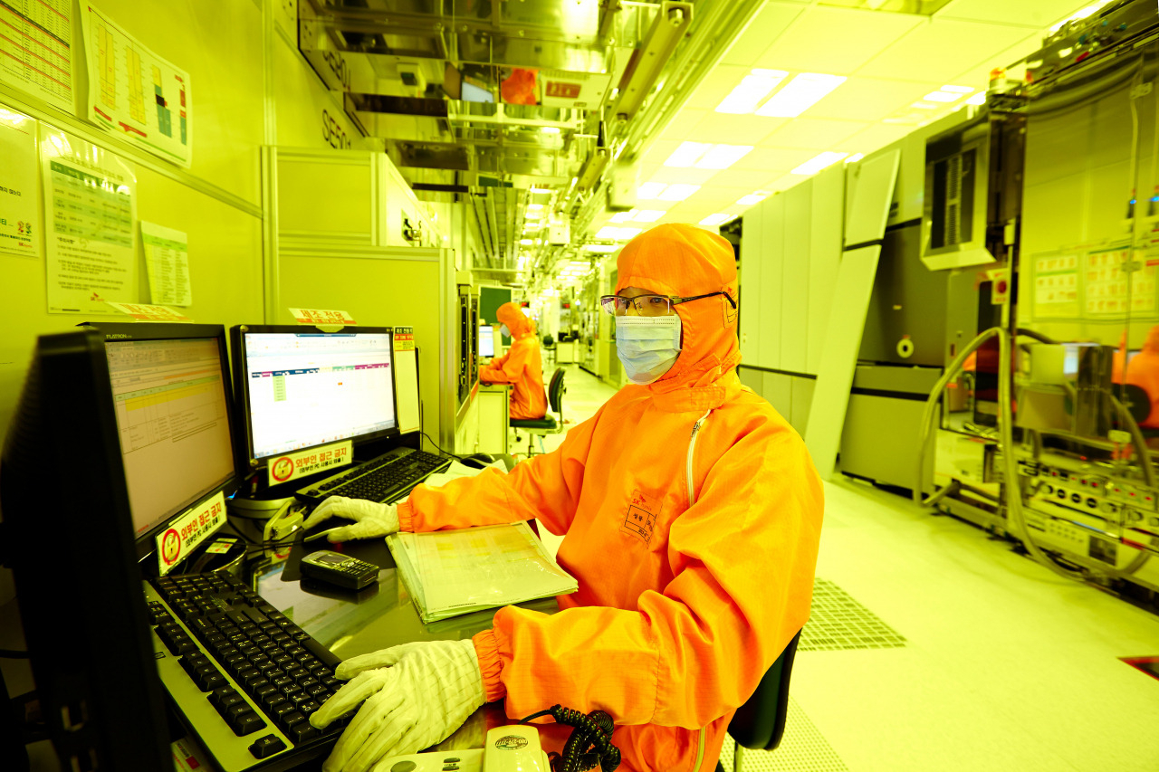 An employee works inside a semiconductor chip plant of SK hynix in this undated photo. (SK hynix)