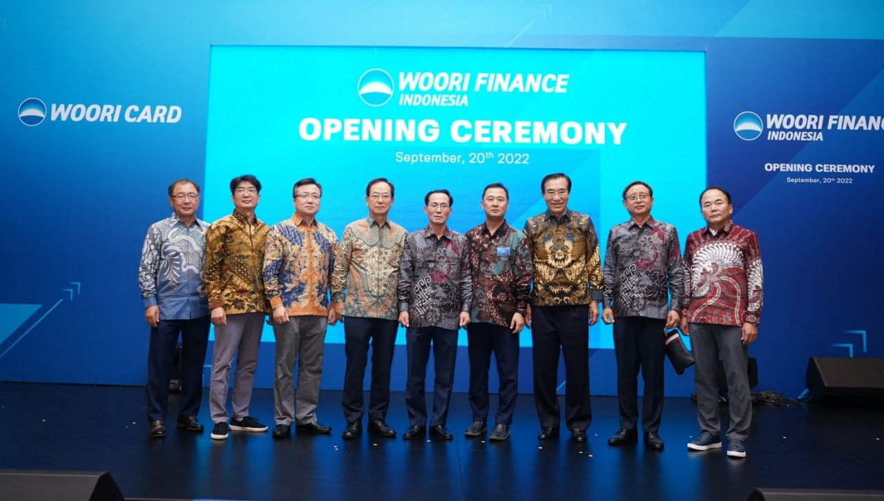 Woori Card chief executive officer Kim Jeong-ki (center) poses with company officials during the opening ceremony for its second global subsidiary on Nov.21 in Jakarta, Indonesia. (Woori Card)