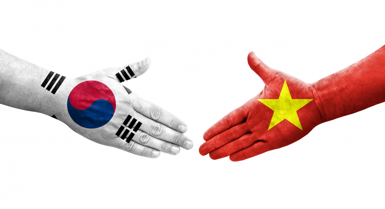 Handshake between South Korea and Vietnam flags painted on hands. (123rf)