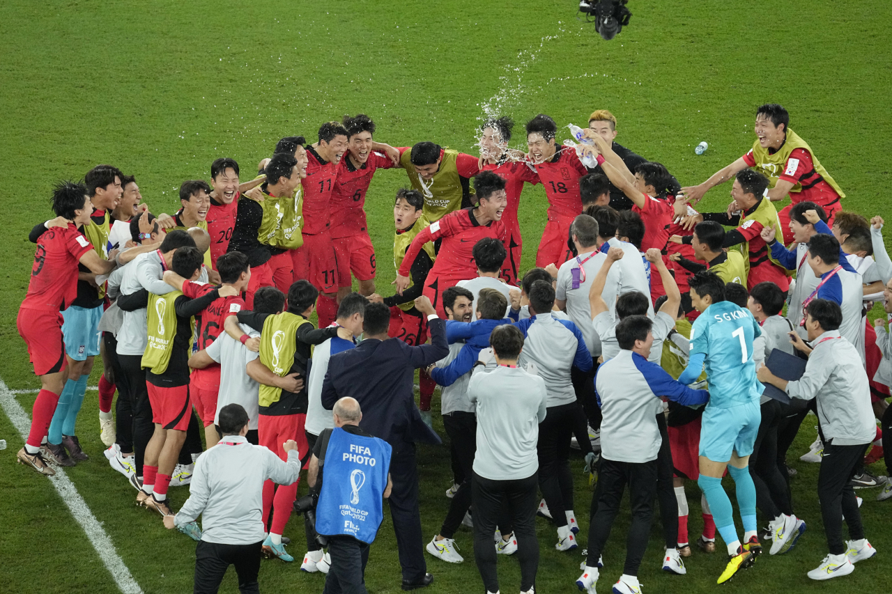 South Korea's team players celebrate after the World Cup group H soccer match between South Korea and Portugal, at the Education City Stadium in Al Rayyan, Qatar, Friday. (AP)