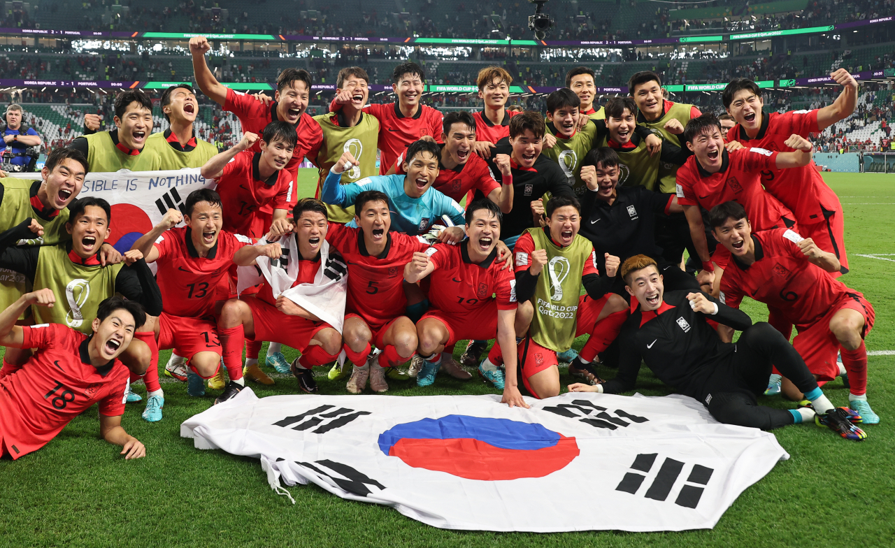 South Korean players celebrate their 2-1 victory over Portugal in the teams' Group H match that sent them to the round of 16 at the FIFA World Cup at Education City Stadium in Al Rayyan, west of Doha on Friday.