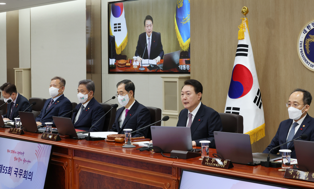 President Yoon Suk-yeol (second from right) speaks during a Cabinet meeting at the presidential office in Seoul on Tuesday. (Yonhap)