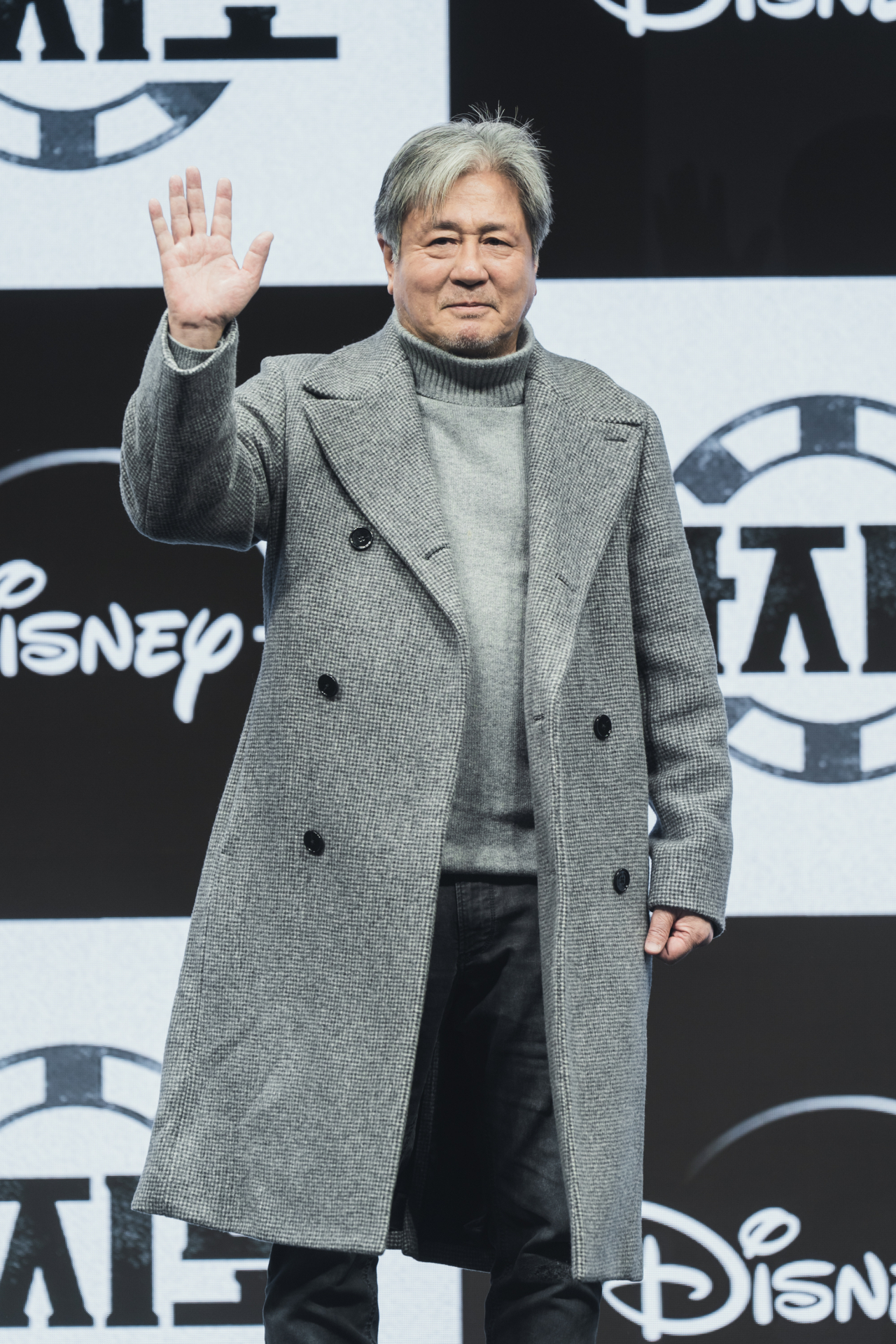 Choi Min-sik poses for photos before a press conference at JW Marriott Dongdaemun Square Seoul, Wednesday. (Walt Disney Co. Korea)