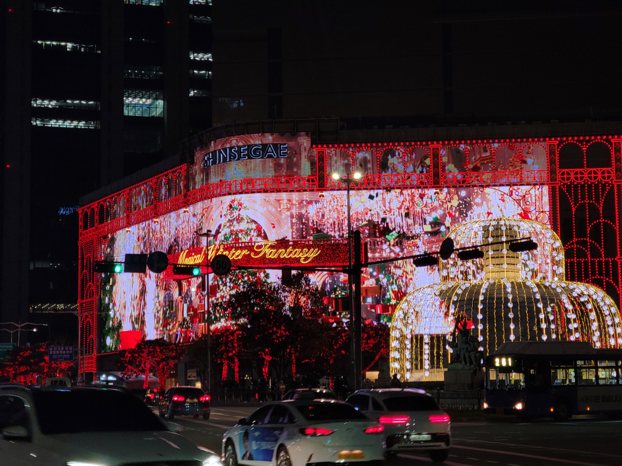 Shinsegae Department Store's Christmas-themed media facade is lit up on Nov. 20. (Park Yuna/The Korea Herald)