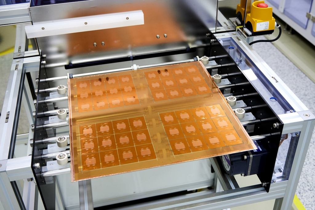 This photo provided on Sunday shows the glass substrate for semiconductor packaging. ( SKC Co.)