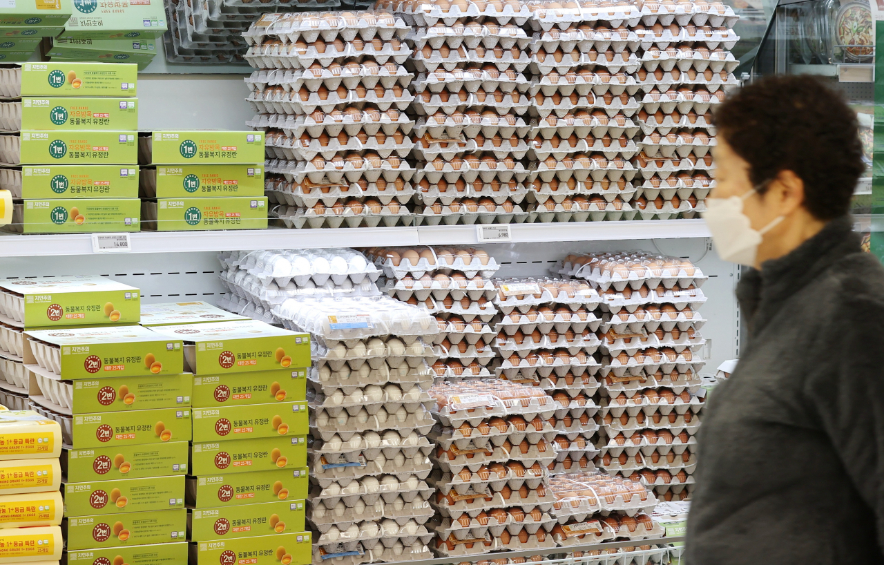 A person shops for eggs at a large supermarket chain store in Seoul. (Yonhap)