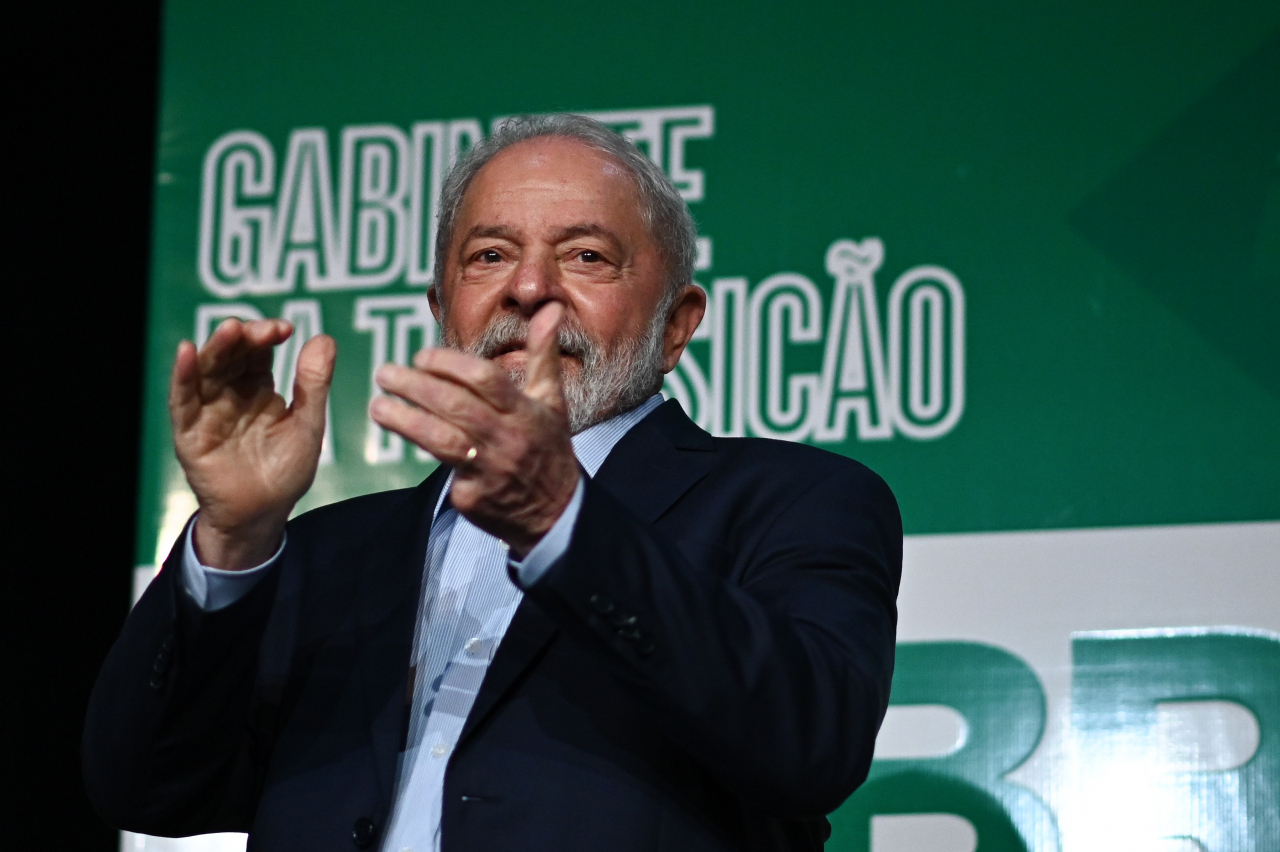 Brazil's President-elect, Luiz Inacio Lula da Silva, claps during a press conference on the final report on the transition and to announce 16 ministers of his future government, in Brasilia, Brazil, Dec. 22. (EPA)