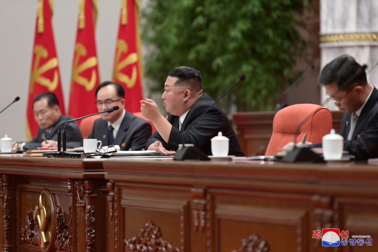 This photo fromThursday shows North Korean leader Kim Jong-un (second from right) presenting ways to enhance suborganizations of the ruling Workers' Party of Korea during the third-day session of the party's plenary meeting. (KCNA)