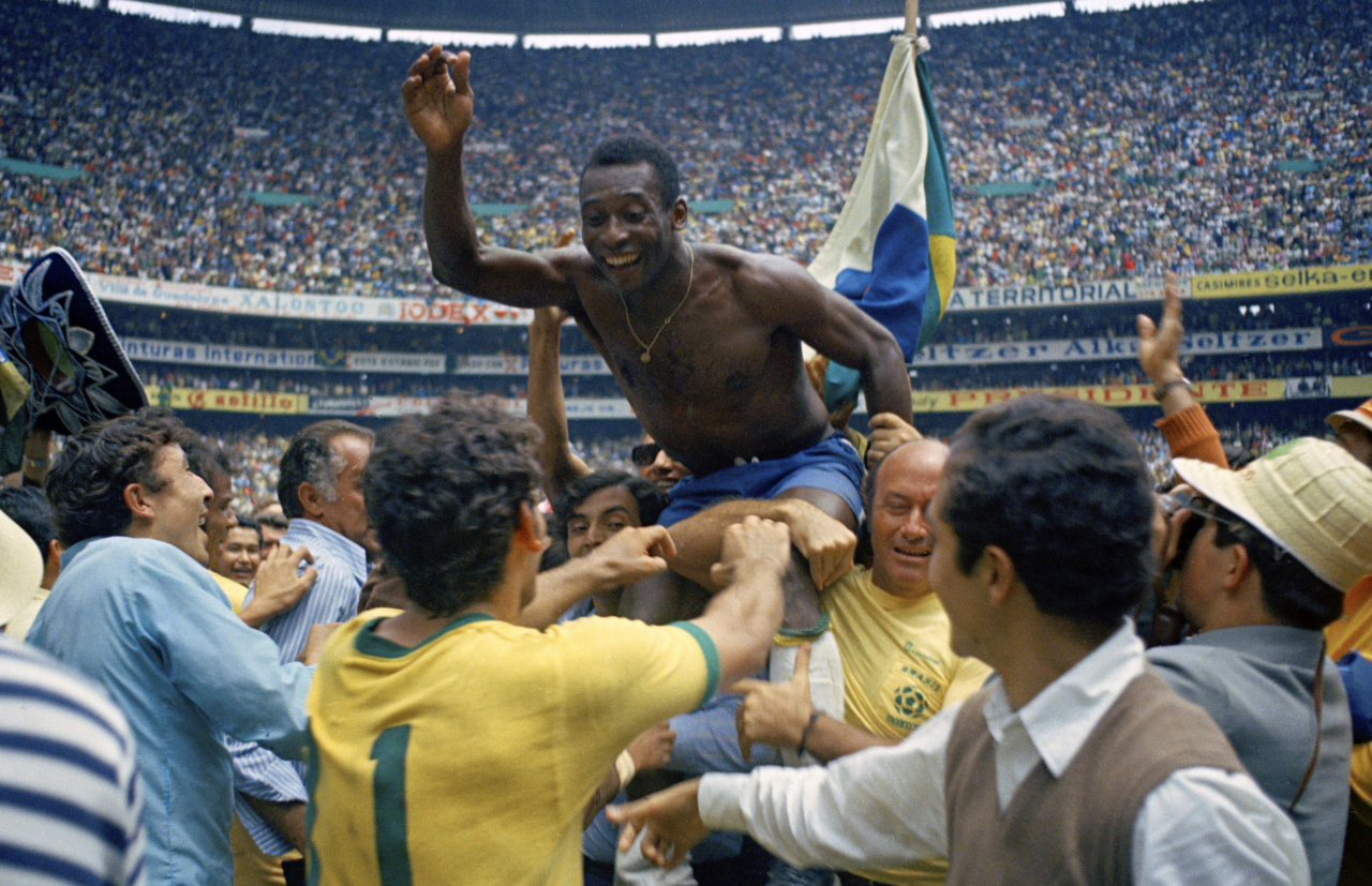 Brazil’s Pele is hoisted on the shoulders of his teammates after Brazil won the World Cup final against Italy, 4-1, in Mexico City's Estadio Azteca, in this June 21, 1970 file photo. (AP)