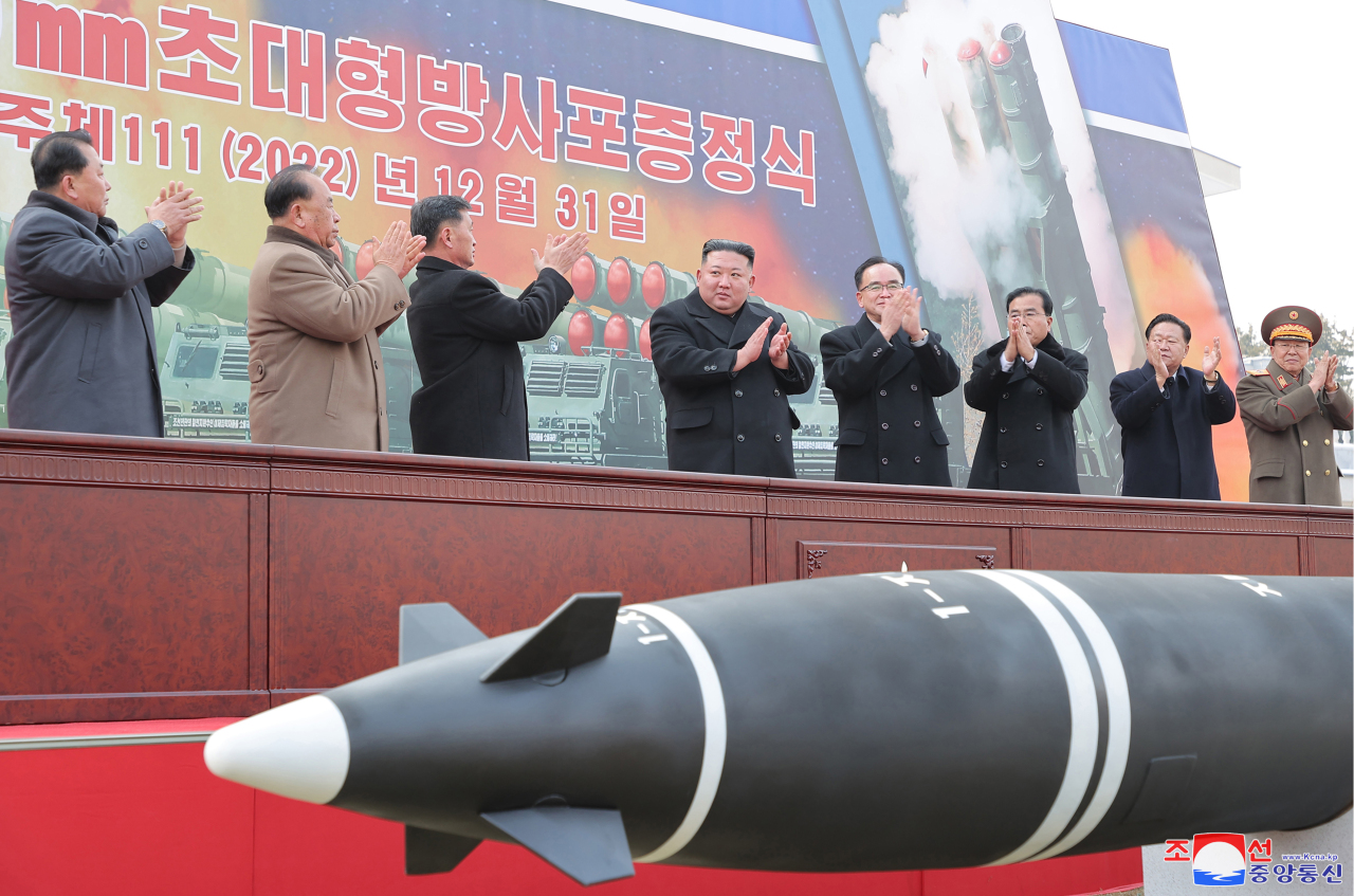 This photo, carried by North Korea's official Korean Central News Agency on Jan. 1, 2023, shows the North holding a ceremony to present its new super-large multiple rocker launcher to a plenary meeting of the ruling Workers' Party of Korea last week. (Yonhap)