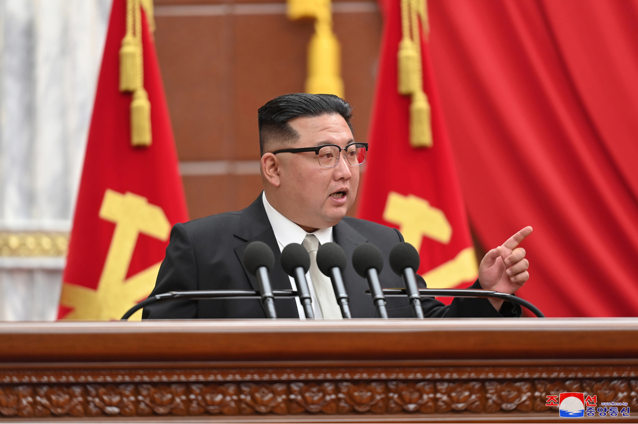 This photo, carried by North Korea's official Korean Central News Agency on Jan. 1, 2023, shows North Korean leader Kim Jong-un speaking at a plenary meeting of the ruling Workers' Party of Korea, raising the need to exponentially increase the number of its nuclear arsenal. (Yonhap)