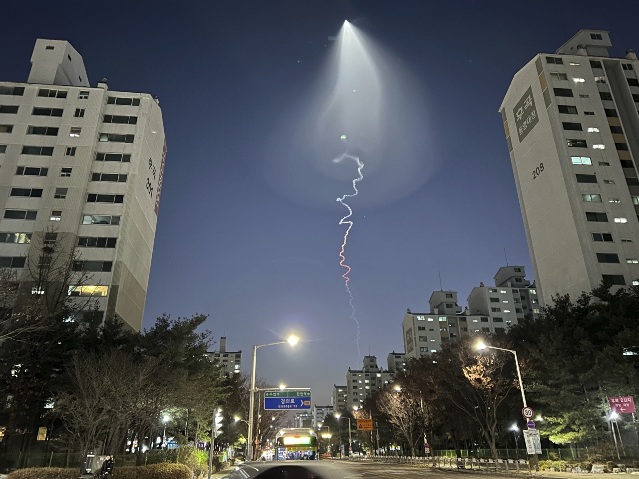 The light trail is seen in Goyang, South Korea, Friday, Dec. 30, 2022. South Korea`s military confirmed it test-fired a solid-fueled rocket on Friday, after its unannounced launch triggered brief public scare of a suspected UFO appearance or a North Korean missile or drone flying. (Photo - AP)