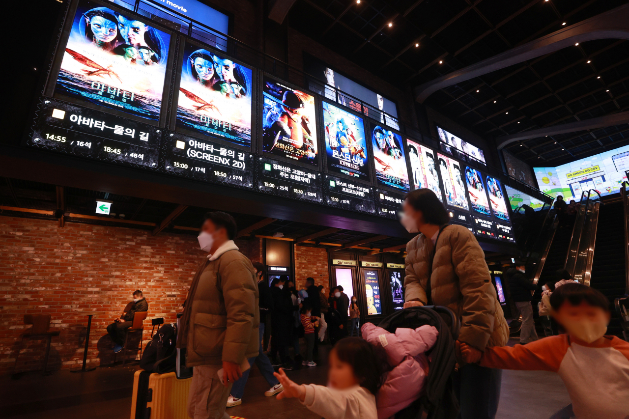 Moviegoers are seen at a local theater in Seoul, on Sunday. (Yonhap)