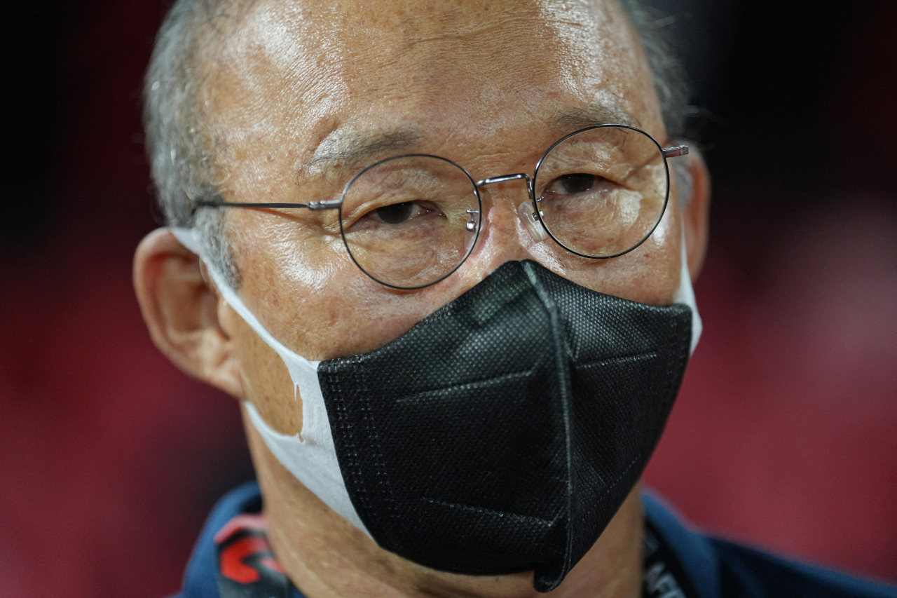 In this photo, Vietnam head coach Park Hang-seo awaits the start of the second leg of the ASEAN Football Federation Championship final against Thailand at Thammasat Stadium in Pathum Thani, Thailand, on Monday. (Reuters)