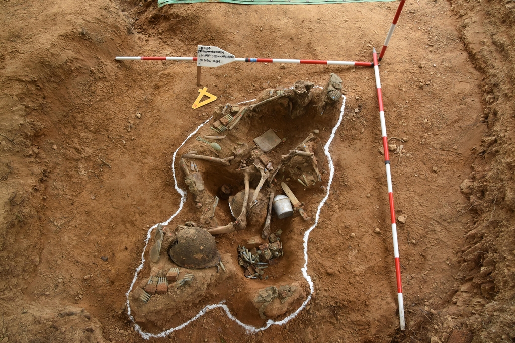 This file photo pshows the remains of Oh Moon-kyo, a soldier who was killed in action at Arrowhead Ridge inside the Demilitarized Zone separating the two Koreas, excavated in June 2019. ( Defense ministry )