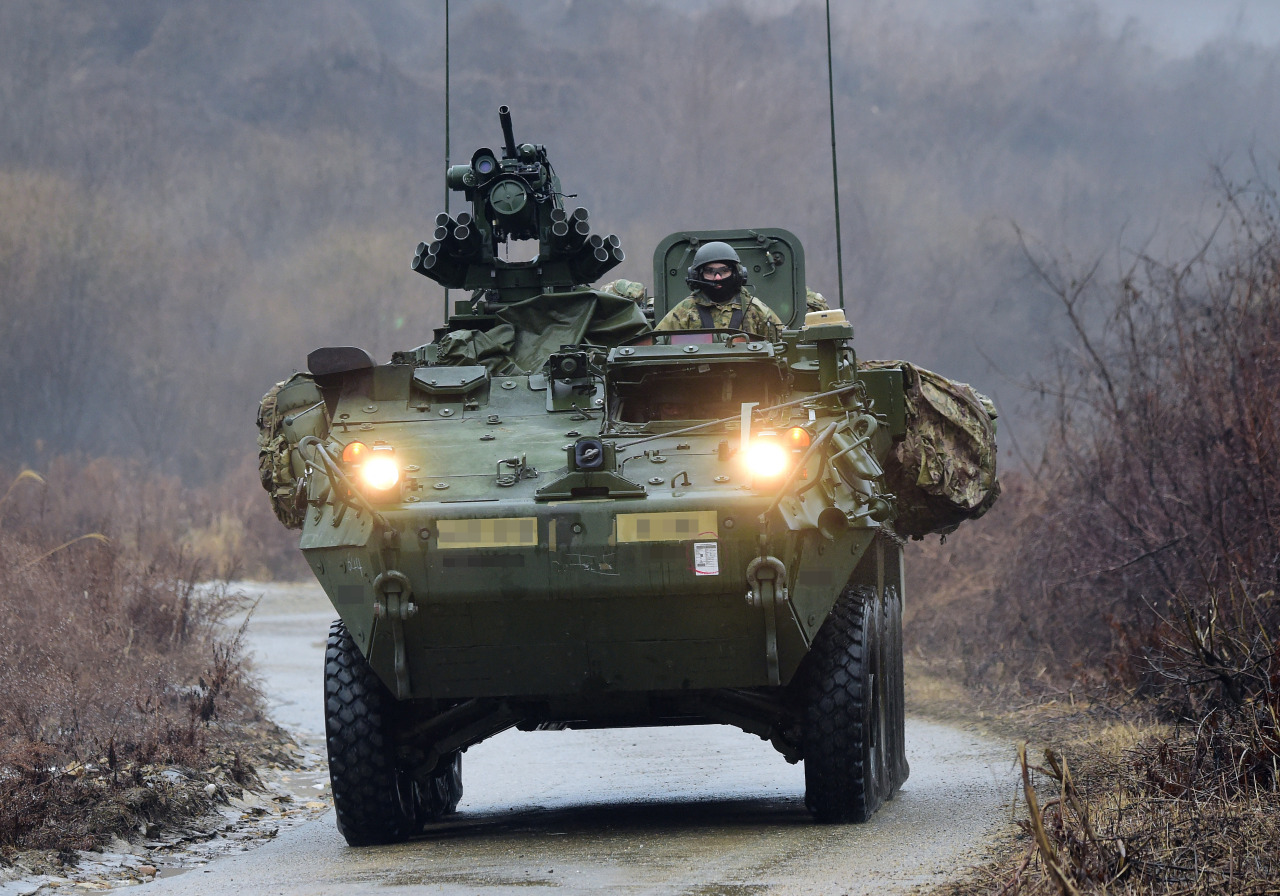 An eight-wheeled U.S. Stryker combat vehicle rolls down a hill during a joint exercise with the South Korean Army`s TIGER Demonstration Brigade at the Mugeon-ri training ground in Paju, Gyeonggi Province, on Jan. 13, 2022. (Pool photo) (Yonhap)