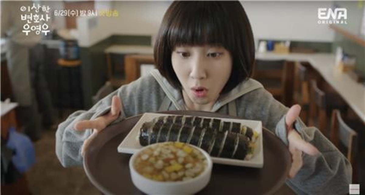 Woo Young-woo, the protagonist of Netflix`s “Extraordinary Attorney Woo,” eats gimbap made by her father. (Netflix)