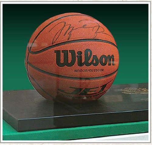 This photo caputured from North Korea's Foreign Language Publishing House on Monday, shows a basketball signed by Michael Jordan, in a photo book of gifts given to the country's former leader Kim Jong-il. (North Korea's Foreign Languages Publishing House)